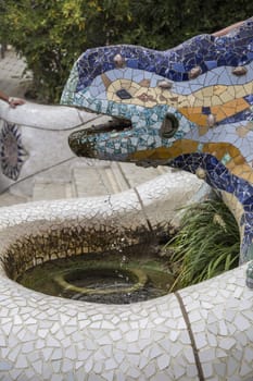 Barcelona, Spain - September 21, 2015: Multicoloured mosaic dragon, Park Gruell, Barcelona, Spain