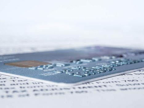 credit card on a paper of financial in shallow depth of field