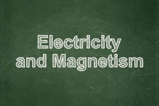 Science concept: text Electricity And Magnetism on Green chalkboard background