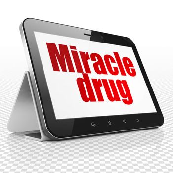 Healthcare concept: Tablet Computer with red text Miracle Drug on display