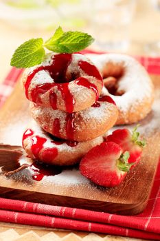 Ring donuts with strawberry syrup