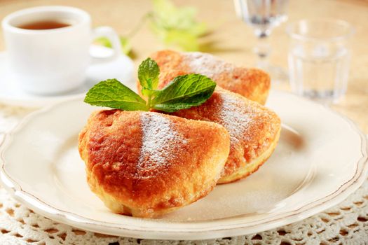 Puff pastry donuts and a cup of tea