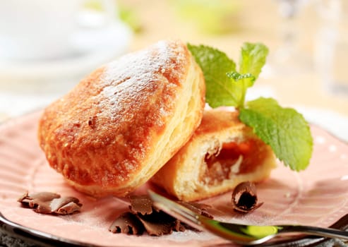 Jam filled donuts on a plate