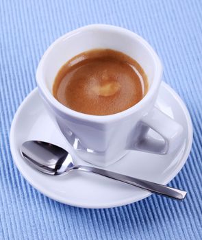 Cup of espresso with golden brown foam