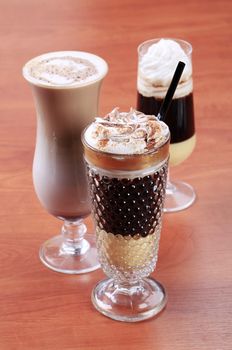 Coffee and chocolate drinks in tall glasses