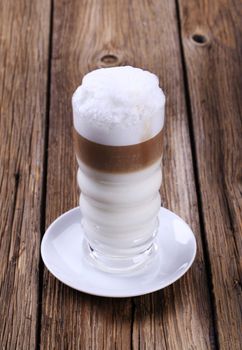 Glass of Latte macchiato with milk foam 