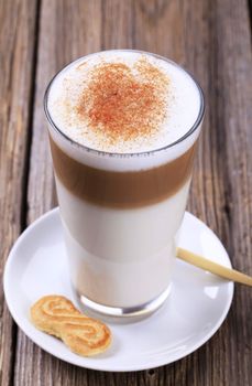 Glass of Latte macchiato with a dusting of nutmeg 