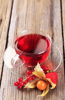 Fruit tea in a glass cup - closeup