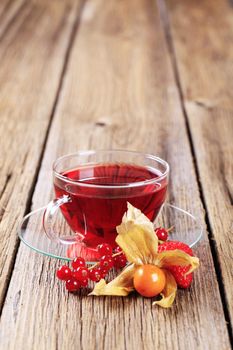 Fruit tea in a glass cup - closeup