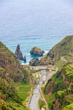 View from the hiking trail Levada do Central da Ribeira da Janela to the Atlantic Ocean, north coast of Madeira