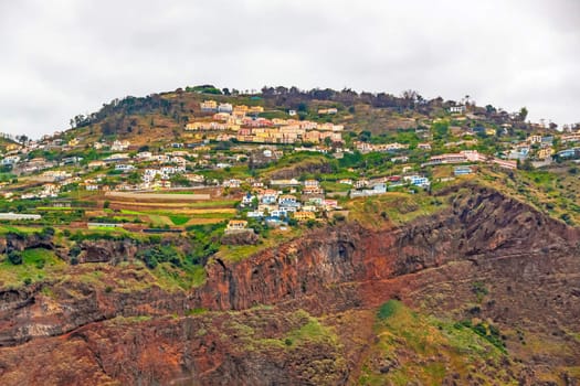 Colorful volcanic cliff coast between Funchal and Canico, Madeira Island, Portugal