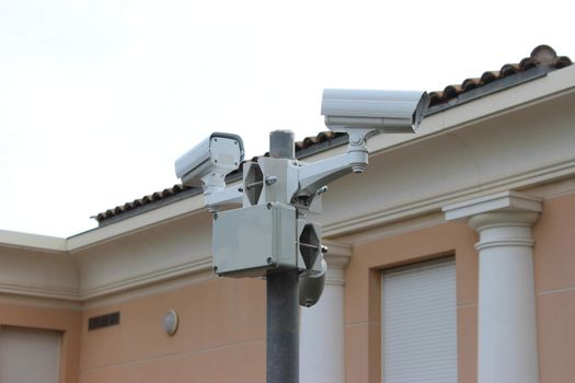 Two CCTV Surveillance Cameras on a pole