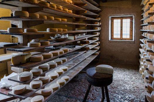 Alpine hut that produces and sells homemade cheeses.