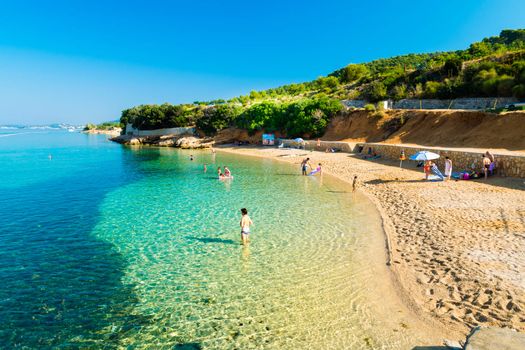 RAB, CROATIA - CIRCA AUGUST 2015: The pristine coastline and crystal clear water of the island of Rab, Croatia.