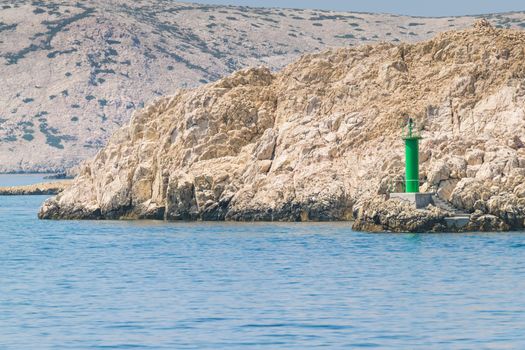 Lighthouse that signals the presence of rocks at passing ships.