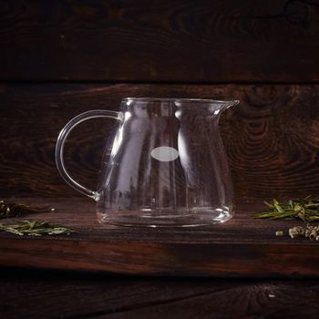 Glass tea pot on the  wood table