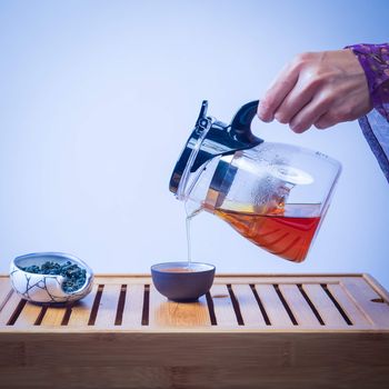 Glass tea pot on the  wood table