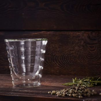 Thermo tea cup, loose tea leaf on wood table