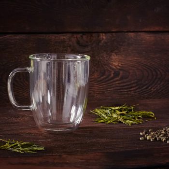 Thermo tea cup, loose tea leaf on wood table