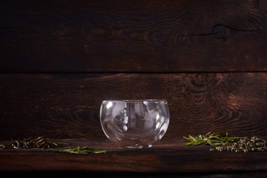 Thermo tea cup, loose tea leaf on wood table