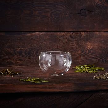 Thermo tea cup, loose tea leaf on wood table