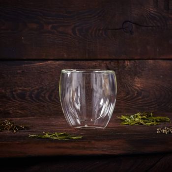 Thermo tea cup, loose tea leaf on wood table