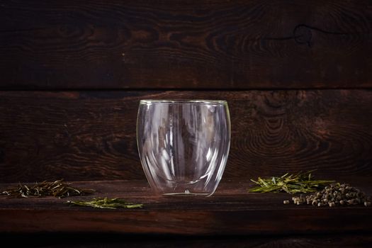 Thermo tea cup, loose tea leaf on wood table