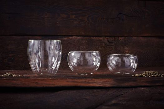 Thermo tea cup, loose tea leaf on wood table