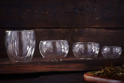 Thermo tea cup, loose tea leaf on wood table