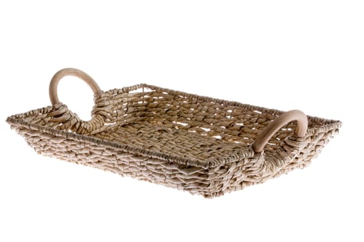 Rustic rectangular wicker tray with curved wooden handles made with willow canes for serving beverages and food, low angle isolated on white