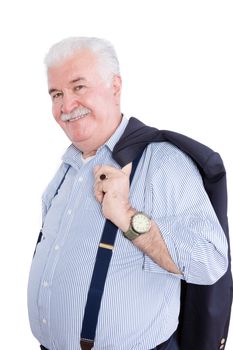 Distinguished white haired retired gentleman with his suit jacket slung over his shoulders and wearing suspenders smiling happily at the camera, on white