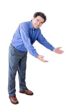 Welcoming business man or host bending forwards with a friendly smile gesturing with his hands to enter, full length isolated on white