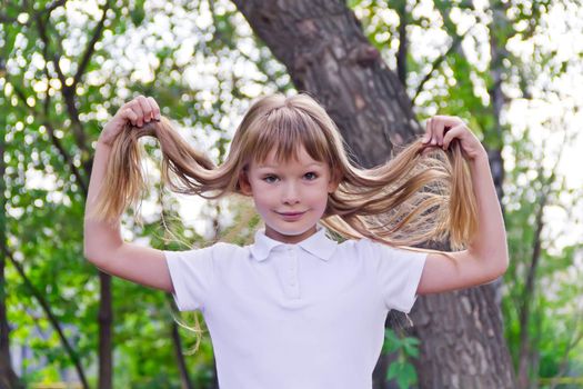 Photo of girl playing with long hair