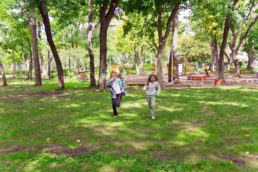 Photo of cute two running girls in summer