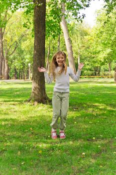 Photo of cute jumping girl in summer