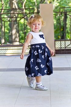 Cute baby girl with curly blond hair