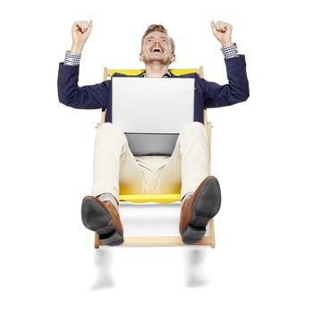 Studio shot of successful young man sitting on a sunbed. Isolated on white background. 