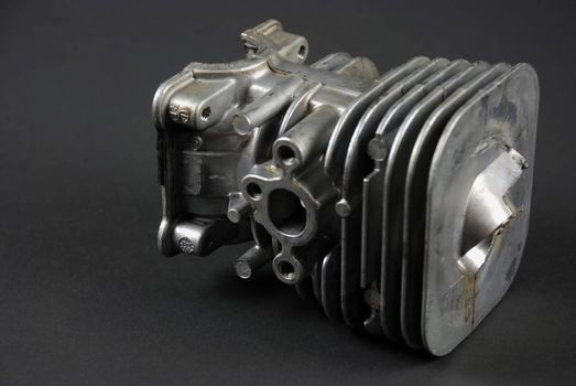 Stock pictures of a small gas engine and a carburetor