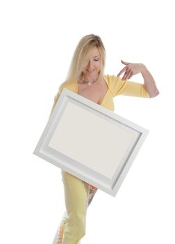 Smiling woman holding a blank picture white box frame and smiling.  Just add your own picture, painting or message, 