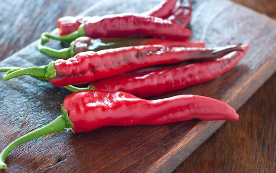 Spicy chilli on wooden table from italy