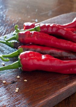 Spicy chilli on wooden table from italy