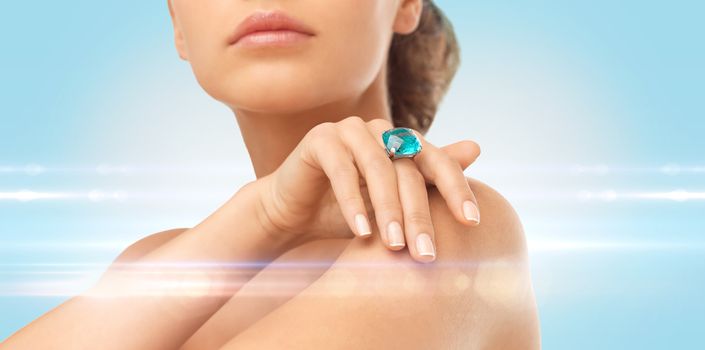 wedding, bridal jewelry and luxury concept - close up of beautiful woman hand with big blue cocktail ring