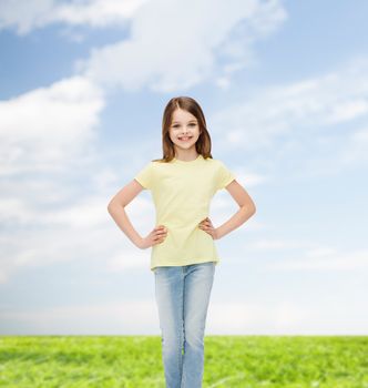 happiness, childhood and people concept - smiling little girl in casual clothes