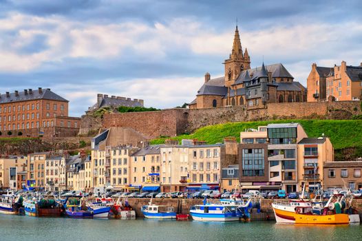 Gothic church on the hill and fishermen boats in port town Granville, Normandy, France