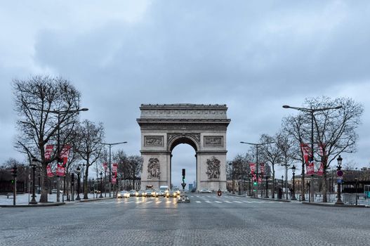PARIS, FRANCE - CIRCA MARCH 2010: Quiet early Sunday morning on the Champs-Elysées and the Arc de Triomphe.