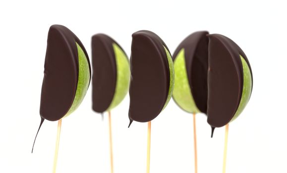 Chocolate dipped apple fruit on a white background