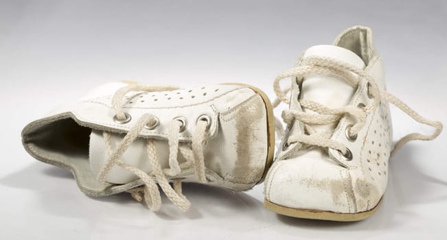 Kids Shoes Untied on white background.