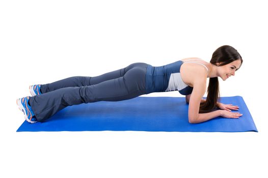 Young woman shows Elbow Plank Workout, isolated on white, side view