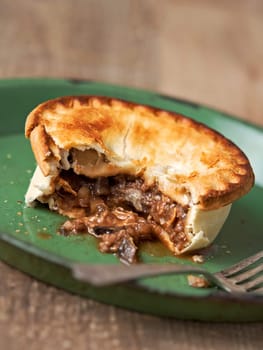 close up of rustic meat and mushroom pie