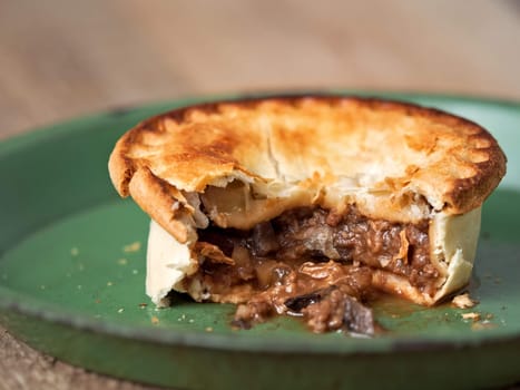 close up of rustic meat and mushroom pie